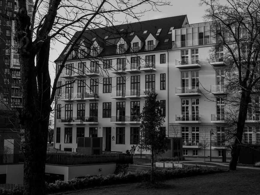 Stylish European apartment complex in black and white with modern architecture.